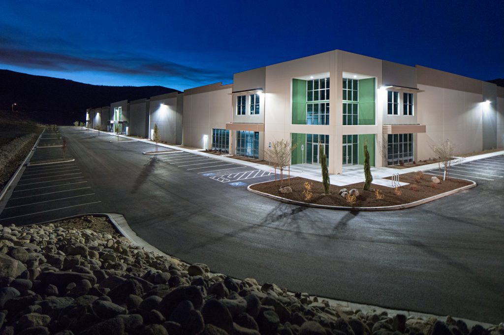 Front corner view of building for the LogistiCenter at I-80 at night time, located in Reno, NV.